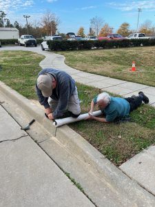 We could not get the end of the 3" pvc pipe off. It would not unscrew. This is the only picture we have of Bob Hill laying down on the job....